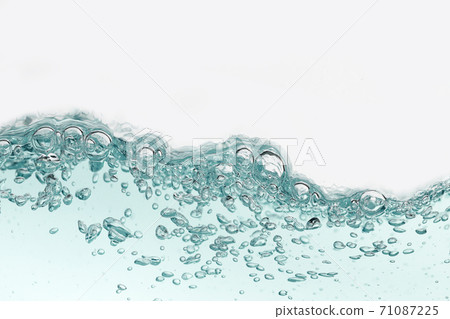 Close up blue water splash with air bubbles. Fresh and clean surface aqua flowing in wave and clean water on white background isolated. Advertising image with free space for your work Close up blue water splash with air bubbles. Fresh and clean surface aqua flowing in wave and clean water on white background isolated. Advertising image with free space for your work 71087225