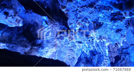 A limestone cave that glows blue 71087989