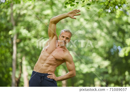 Mature Man Exercising Shirtless 71089037