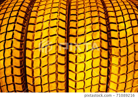 Gold tire tread close-up.The concept of expensive car maintenance. 71089216