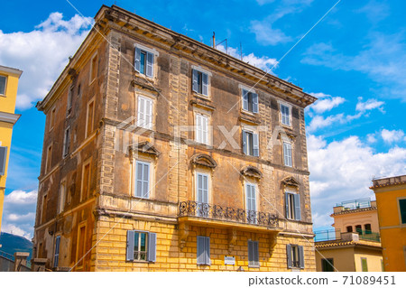 italian houses colorful old building with vibrant blue sky  71089451