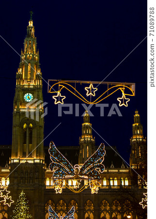 The Lighting decoration at traditional Christmas market in front of Rathaus - City hall, Vienna. The Lighting decoration at traditional Christmas market in front of Rathaus - City hall, Vienna. 71089788