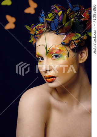 woman with summer creative make up like fairy butterfly closeup bright colored background 71089860