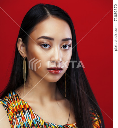 beauty young asian girl with fashion make up on red background , beauty stylish look beauty young asian girl with fashion make up on red background , beauty stylish look 71089870