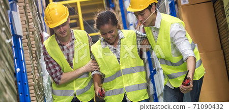 Warehouse worker help colleague first aid after accident panorama 71090432