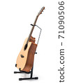 Acoustic guitar with stand isolated on white background 71090506