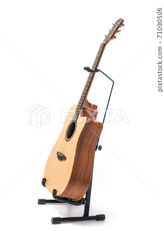 Acoustic guitar with stand isolated on white background 71090506