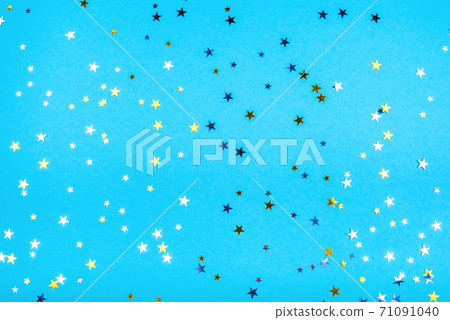 Golden and silver stars on blue background. 71091040