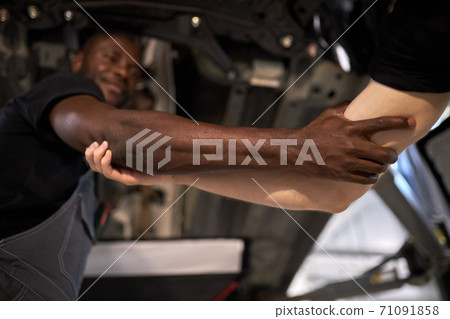 focus on hands of diverse men holding each other focus on hands of diverse men holding each other 71091858