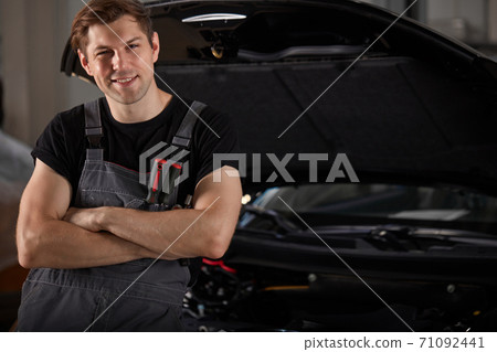 portrait of handsome caucasian auto mechanic man 71092441
