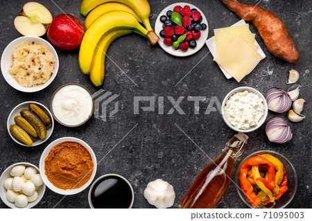 Top view of variety probiotic and prebiotic foods on black background Top view of variety probiotic and prebiotic foods on black background 71095003