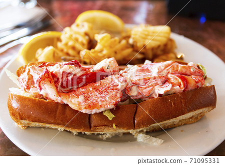 Lobster roll on a plate in a restaurant in Maine Lobster roll on a plate in a restaurant in Maine 71095331