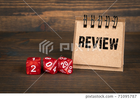 2020 REVIEW. Business concept. Red dice and notepad 71095787