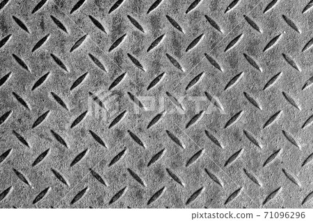 Abstract background of old grey rusty diamondplate rusty metal panel. Grunge brown rough grip industrial steel texture pattern 71096296