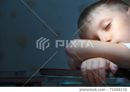 Boy fell asleep for school lessons. Boy fell asleep for school lessons. 71098138