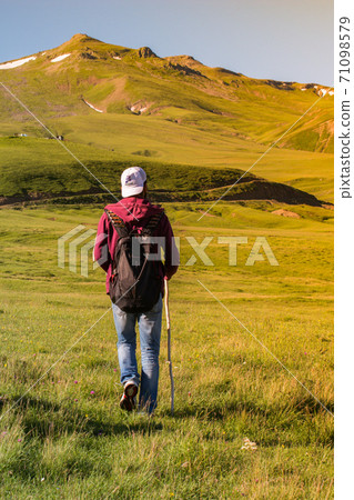 Hikers with backpacks and trekking poles walking in Artvin highland 71098579