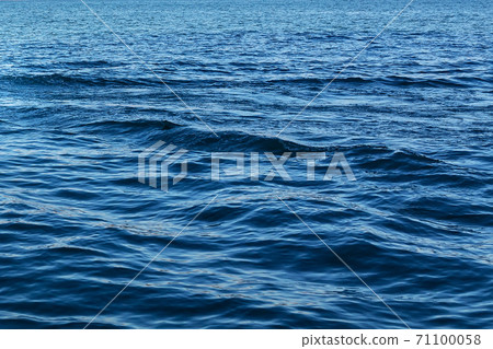 Blue sea surface with waves. The seascape is beautiful. Background 71100058
