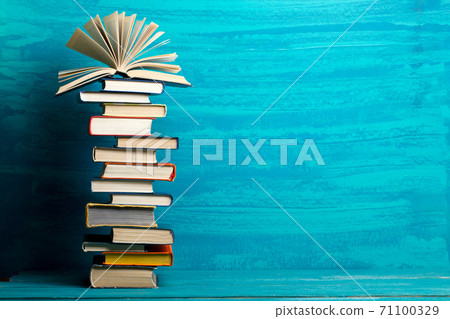 Books on wooden desk table and abstract background. Education background. Copy Space. Back to school. 71100329