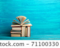 Books on wooden desk table and abstract background. Education background. Copy Space. Back to school. 71100330