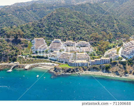 Aerial view of Hamilton Cove with apartment condo building on the cliff, Santa Catalina Island. USA Aerial view of Hamilton Cove with apartment condo building on the cliff, Santa Catalina Island. USA 71100688