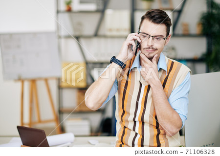 Pensive man talking on phone Pensive man talking on phone 71106328