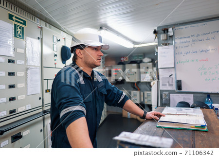 Marine engineer officer in engine control room ECR 71106342