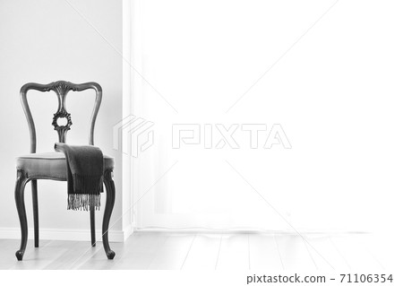 Mahogany chair and cashmere muffler. British antique furniture (bright windows, monochrome image) Mahogany chair and cashmere muffler. British antique furniture (bright windows, monochrome image) 71106354