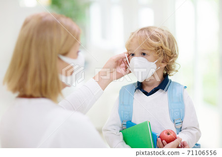 Mother and child with face mask and hand sanitizer Mother and child with face mask and hand sanitizer 71106556