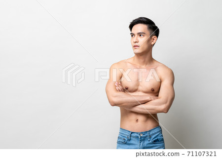 Portrait of handsome shirtless Asian man looking at the side with arms crossed Portrait of handsome shirtless Asian man looking at the side with arms crossed 71107321