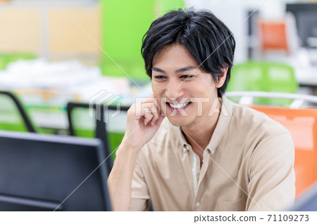 A man who is pleased with the good news in the office A man who is pleased with the good news in the office 71109273