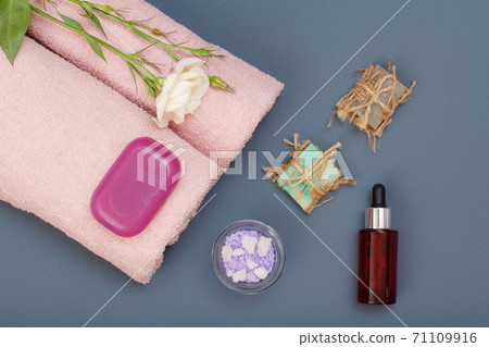 Spa products for facial and body care. Sea salt, homemade soap and towel. 71109916