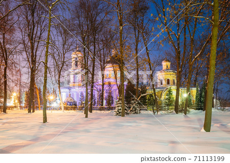 Gomel, Belarus. City Park In Winter Night. Peter And Paul Cathedral In Homiel Rumyantsevs And Paskeviches Park. Famous Local Landmark In Snow Gomel, Belarus. City Park In Winter Night. Peter And Paul Cathedral In Homiel Rumyantsevs And Paskeviches Park. Famous Local Landmark In Snow 71113199