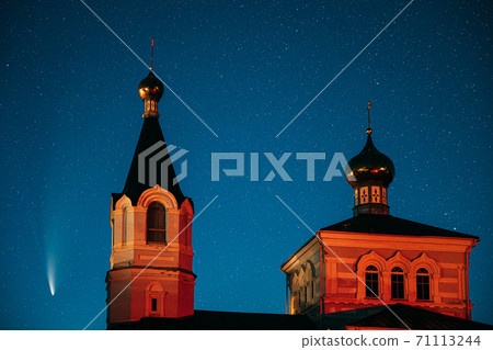 Korma Village, Dobrush District, Belarus. Comet Neowise C2020f3 In Night Starry Sky And St. John The Korma Convent Church In Korma Village. Famous Orthodox Church And Historic Heritage Korma Village, Dobrush District, Belarus. Comet Neowise C2020f3 In Night Starry Sky And St. John The Korma Convent Church In Korma Village. Famous Orthodox Church And Historic Heritage 71113244