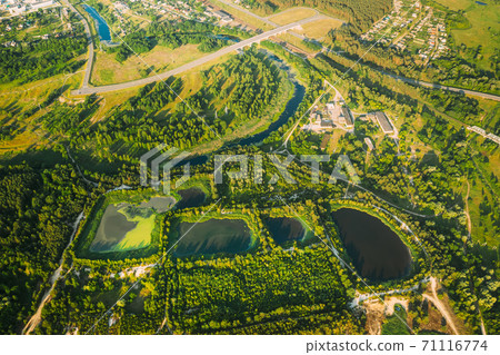 Aerial View Retention Basins, Wet Pond, Wet Detention Basin Or Stormwater Management Pond, Is An Artificial Pond With Vegetation Around The Perimeter, And Includes A Permanent Pool Of Water In Its 71116774