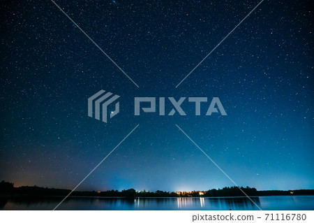Village Novoye Lyadno, Lyepyel District, Vitebsk Province, Belarus. Night Stars Above Lepel Lake. Natural Starry Sky Background Backdrop Landscape 71116780