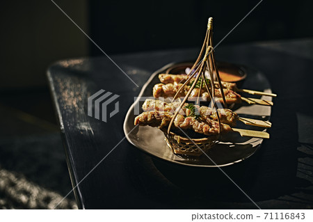 Pork satay ,Grilled pork served with peanut sauce or sweet and sour sauce Pork satay ,Grilled pork served with peanut sauce or sweet and sour sauce 71116843