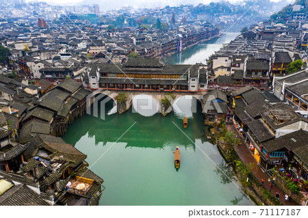 Aerial view of beautiful Fenghuang ancient town and Tuojiang river 71117187