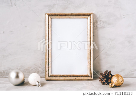 Golden photo frame and christmas decorations. Golden photo frame and christmas decorations. 71118133