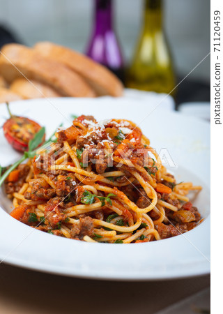 Traditional Italian pasta spaghetti with carbanara meat. 71120459