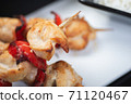 Traditional, oriental and Asian kebabs on a wooden skewer of grilled chicken pieces boiled rice as a garnish. 71120467