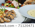 Top view of a restaurant table served with a multi-course set lunch and drink. Complex lunch. 71120471