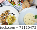 Top view of a restaurant table served with a multi-course set lunch and drink. Complex lunch. 71120472