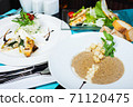 Mushroom soup, white fish fillet with herbs and rice, salad with chicken breast and vegetables. 71120475