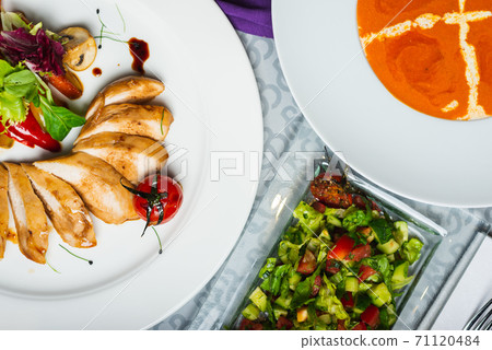 Top view of a restaurant table served with a multi-course set lunch and drink. Complex lunch. Top view of a restaurant table served with a multi-course set lunch and drink. Complex lunch. 71120484