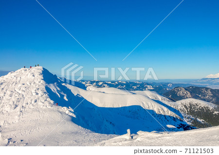 Snowy Peaks and Blue Sky Snowy Peaks and Blue Sky 71121503