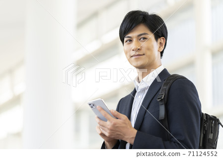 Young man with a smartphone Young man with a smartphone 71124552