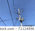 Clear sky and utility poles 71124896