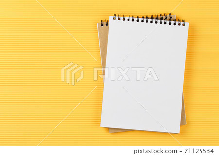 open notebook on corrugated yellow background open notebook on corrugated yellow background 71125534