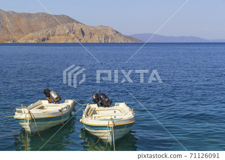Traditional fishing boats in the aegean sea, Greece. 71126091