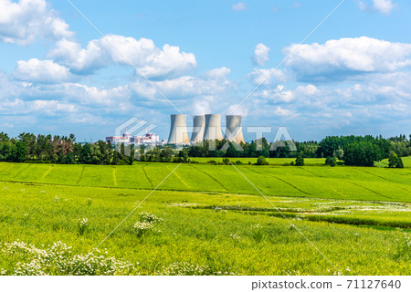 Nuclear power plant on the background of beautiful green summer meadow. Temelin, Czech Republic 71127640